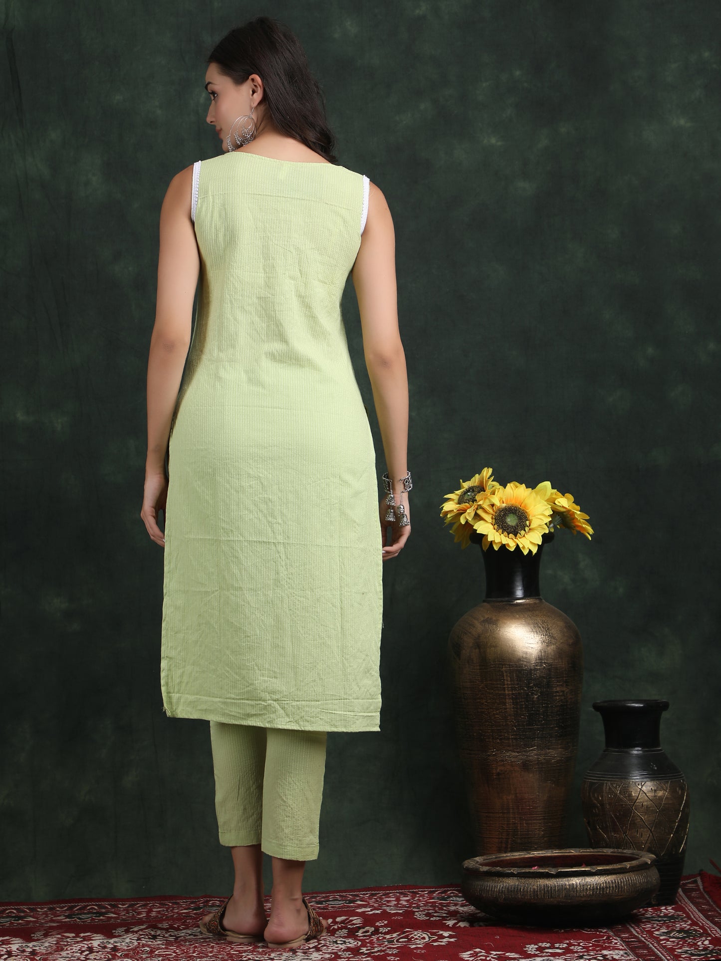 sleevless teek green kurti with pant suit set